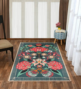 Machine washable teal area rug with floral design.
